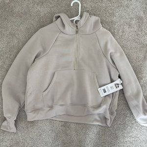 This is a tan half zip with hood.